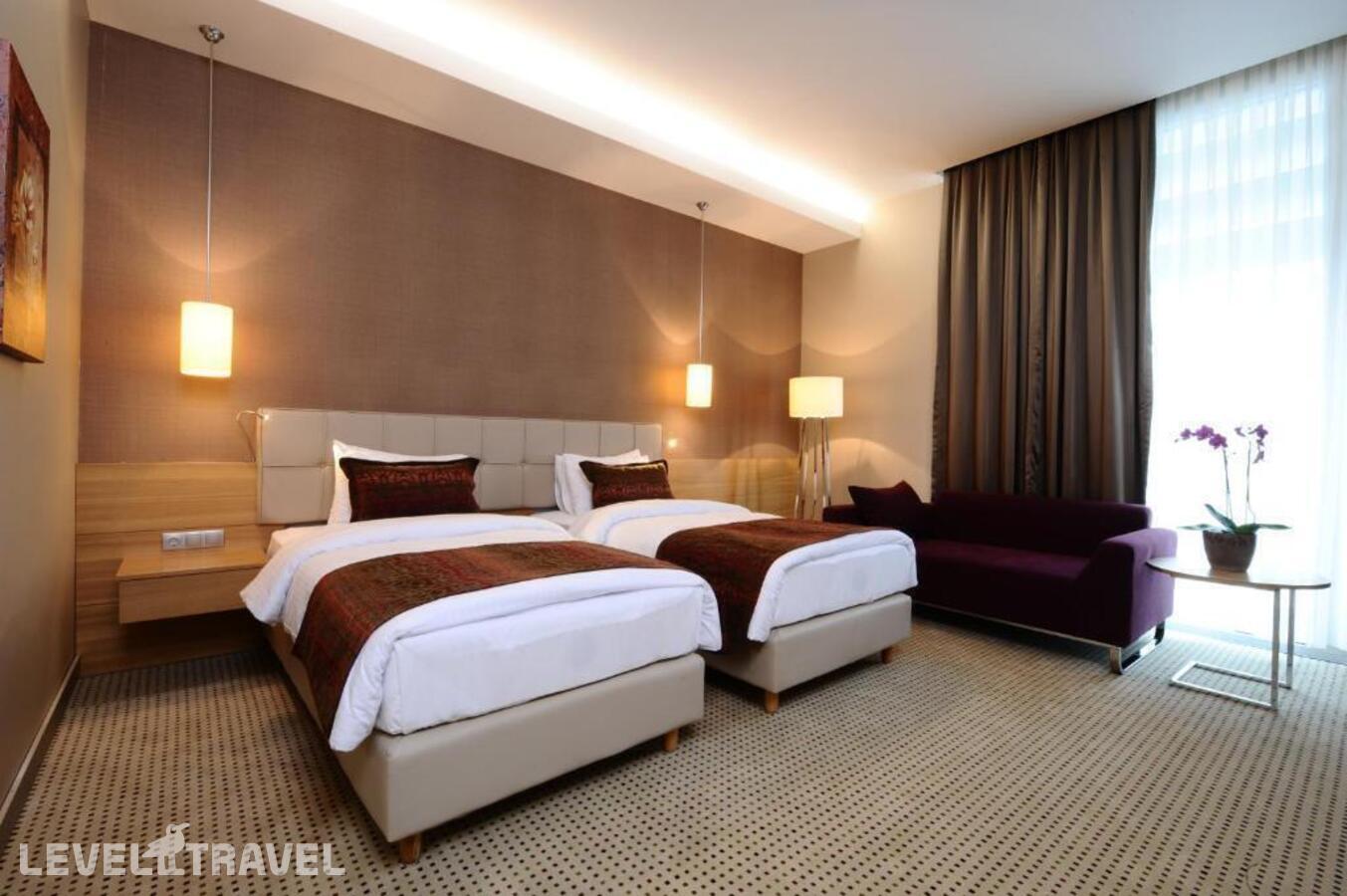 фотографии номера Представительский (две односпальные кровати) отеля Ramada By Wyndham Podgorica в Черногория(Подгорица) - фото №1