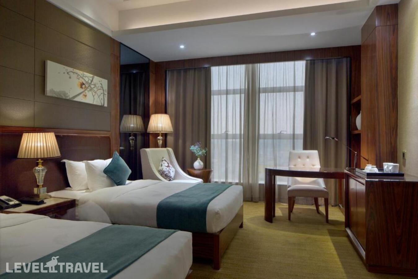 фотографии номера Делюкс (две односпальные кровати) отеля Honder International Hotel в Китай(Гуанчжоу) - фото №7