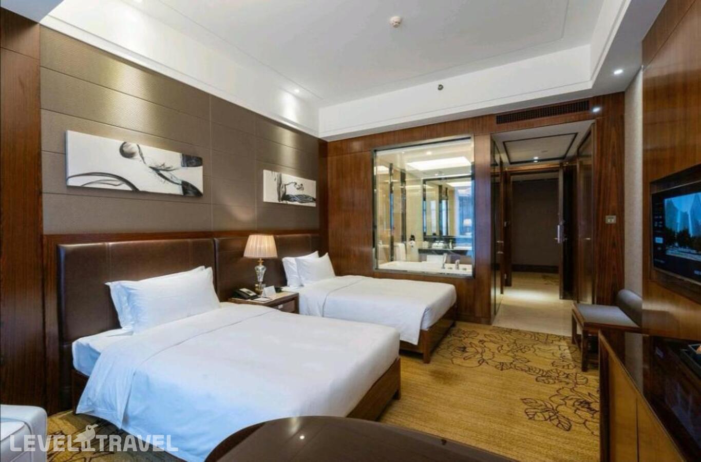 фотографии номера Делюкс (две односпальные кровати) отеля Honder International Hotel в Китай(Гуанчжоу) - фото №5