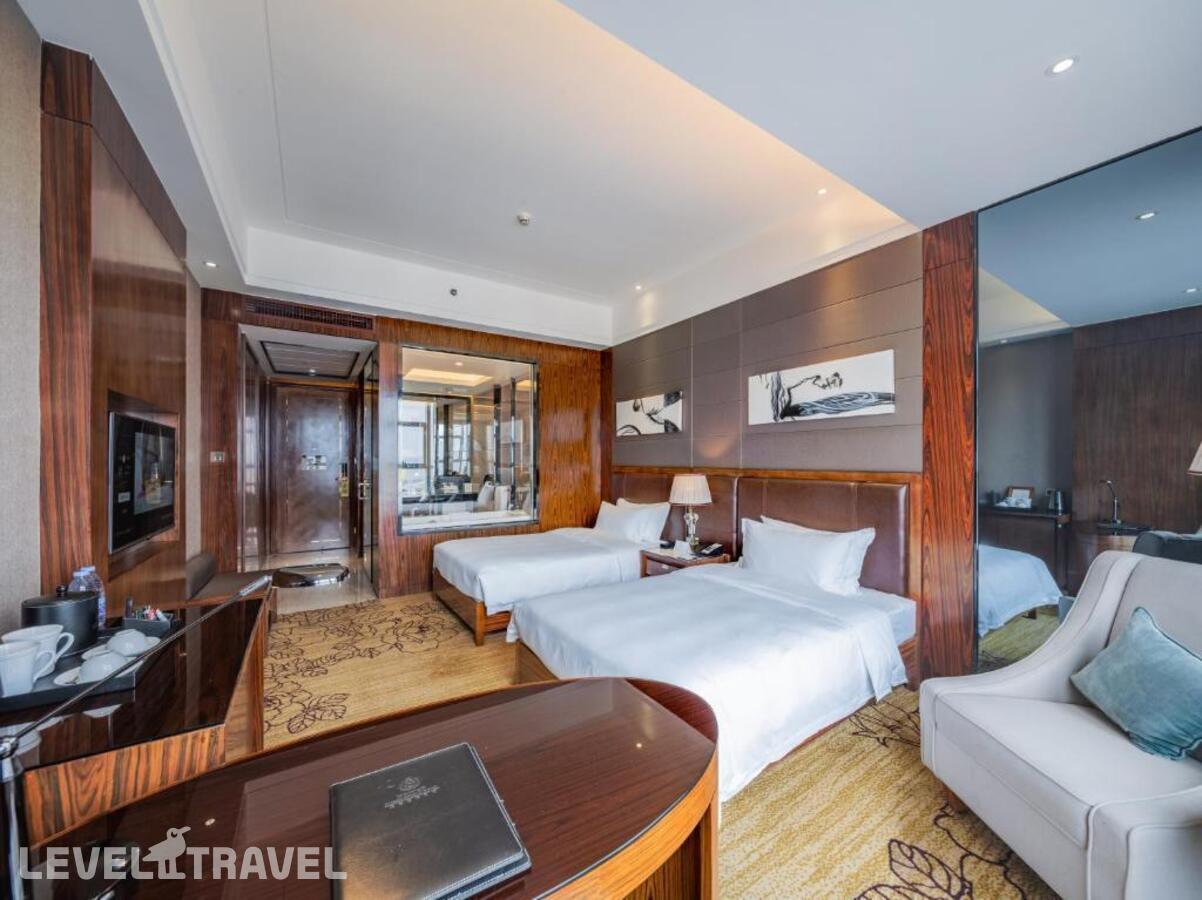 фотографии номера Делюкс (две односпальные кровати) отеля Honder International Hotel в Китай(Гуанчжоу) - фото №4