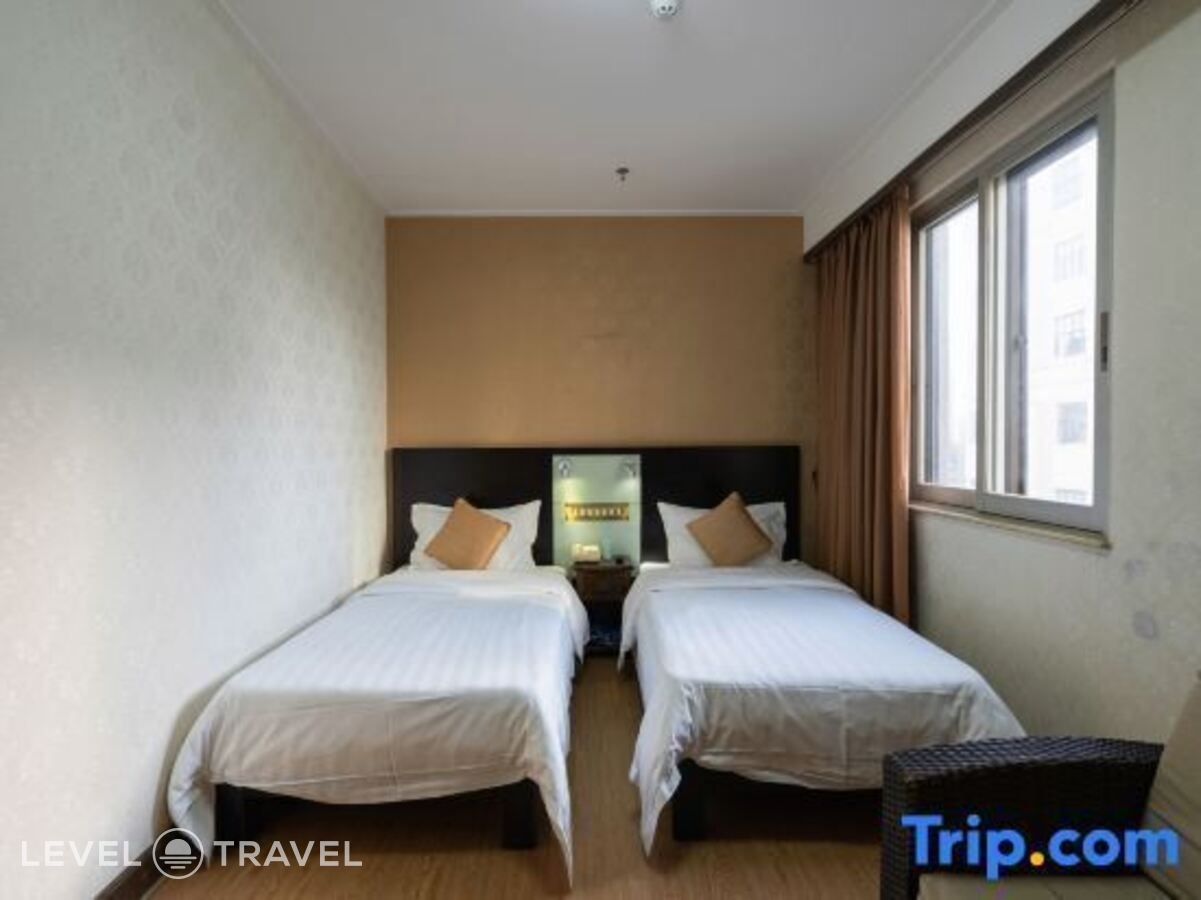 фотографии номера Делюкс (две односпальные кровати) отеля Xinhua Hotel в Китай(Гуанчжоу) - фото №3