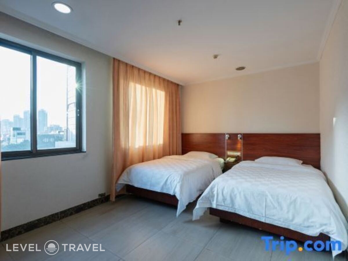 фотографии номера Делюкс (две односпальные кровати) отеля Xinhua Hotel в Китай(Гуанчжоу) - фото №8