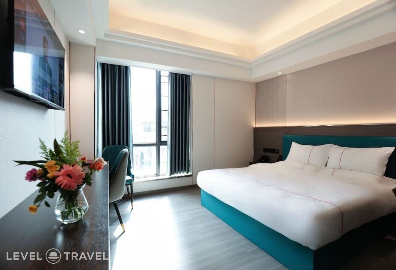 фотографии номера Комфорт (две односпальные кровати) отеля Guangzhou Meigang Hotel в Китай(Гуанчжоу) - фото №2