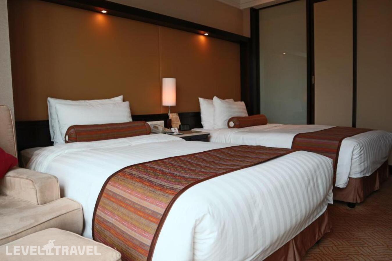 фотографии номера Делюкс (две односпальные кровати) отеля Howard Johnson Huaihai Hotel Shanghai в Китай(Шанхай) - фото №2