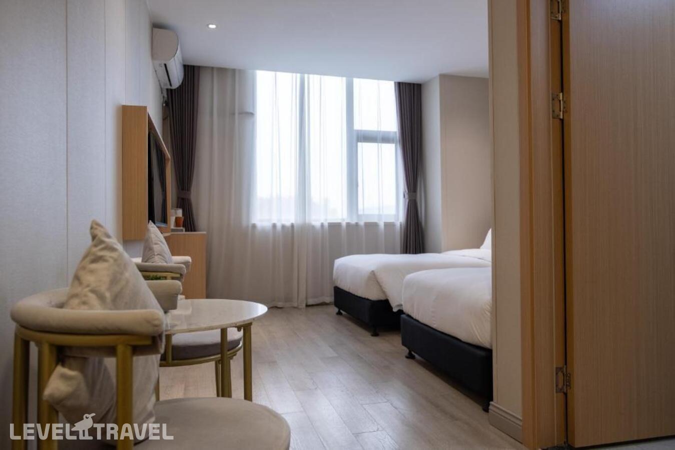 фотографии номера Стандартный (две односпальные кровати) отеля Shanghai Joyful Yard Hotel в Китай(Шанхай) - фото №2