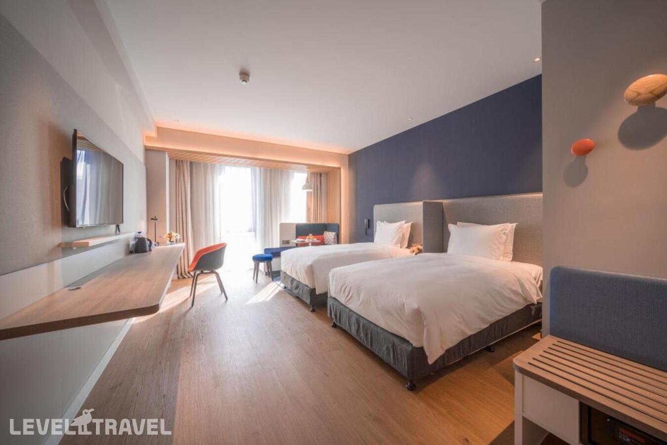 фотографии номера Улучшенный (две односпальные кровати) отеля Holiday Inn Express Shanghai Huijin, An Ihg Hotel в Китай(Шанхай) - фото №1