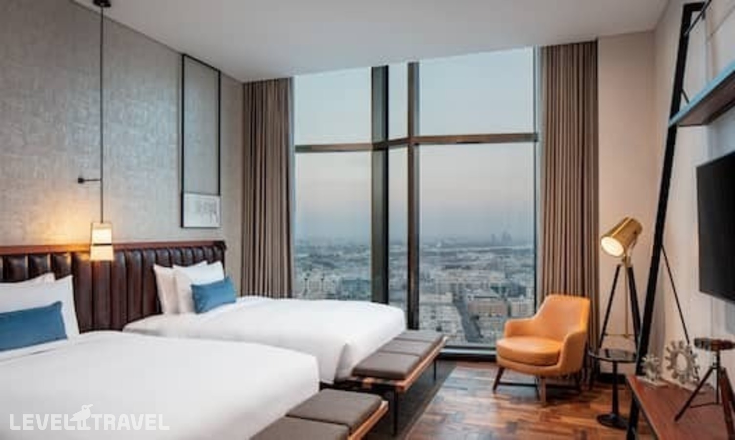 фотографии номера Стандартный (две односпальные кровати) отеля Doubletree By Hilton Dubai M Square Hotel & Residences в ОАЭ(Бар Дубай) - фото №1