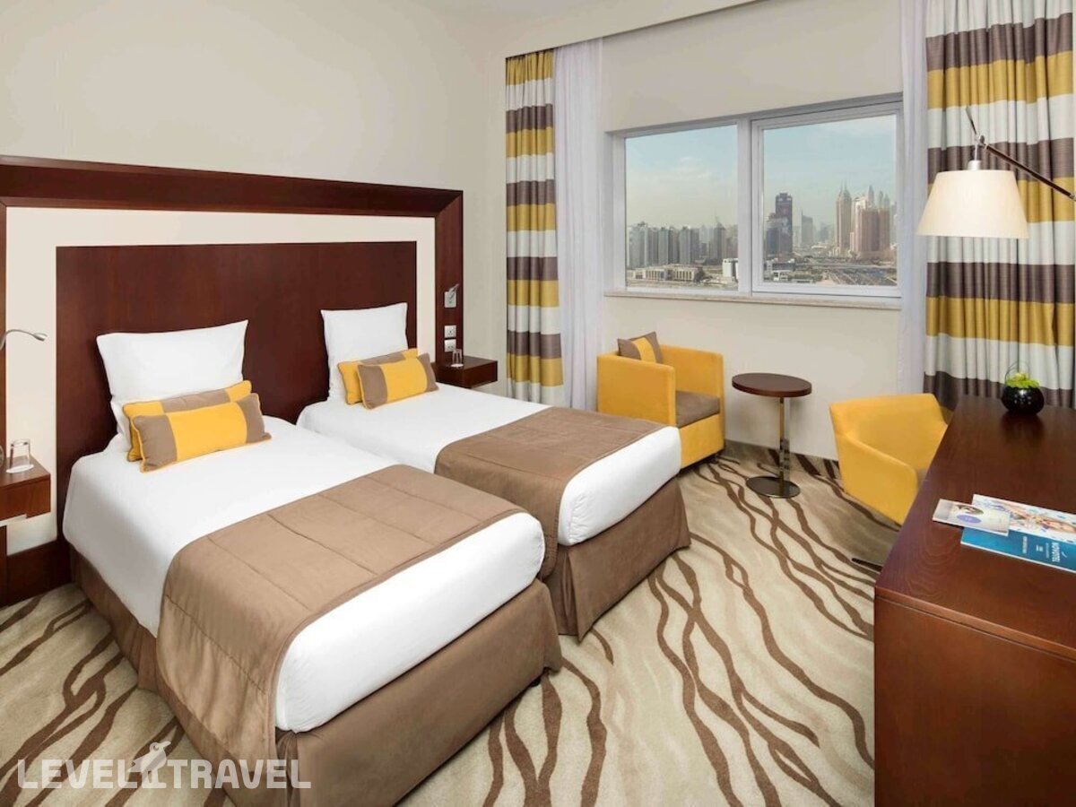 фотографии номера Улучшенный (две односпальные кровати) отеля Novotel Al Barsha в ОАЭ(Аль Барша) - фото №1