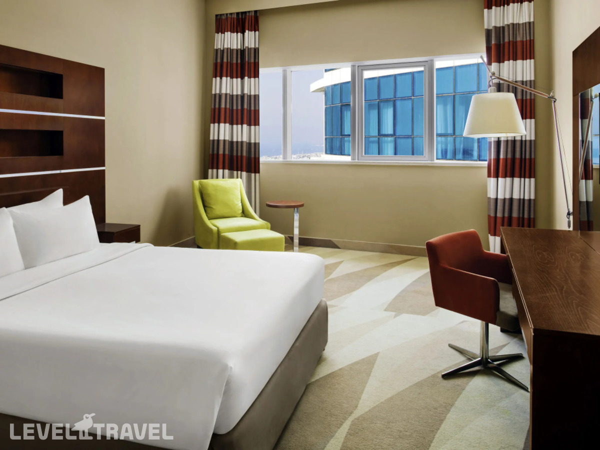 фотографии номера Люкс (2 комнаты) отеля Novotel Al Barsha в ОАЭ(Аль Барша) - фото №1