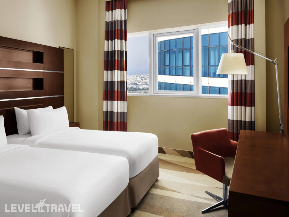 фотографии номера Люкс (2 комнаты) отеля Novotel Al Barsha в ОАЭ(Аль Барша) - фото №2