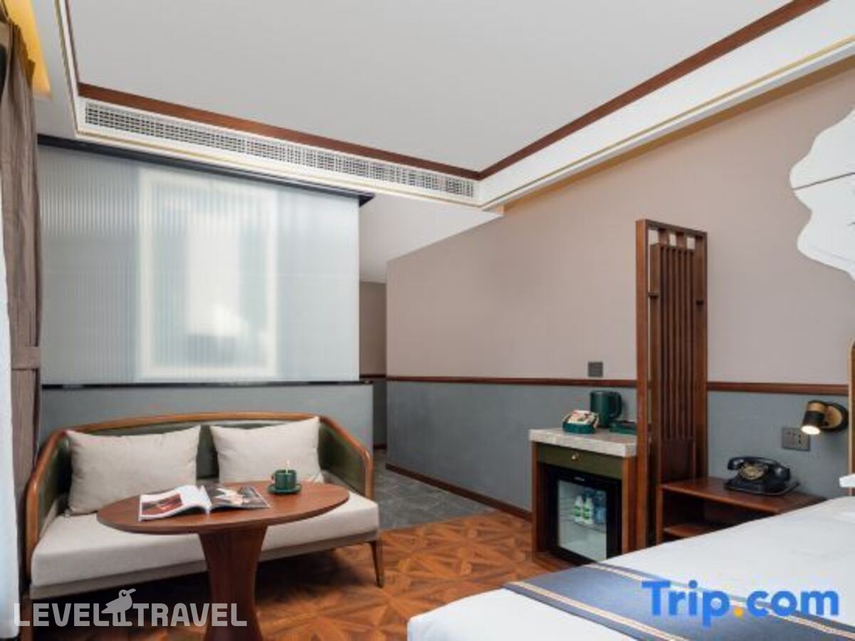 фотографии номера Номер бизнес (две односпальные кровати) отеля Nostalgia S Hotel (Beijing Xi Dan Jinrong Street) в Китай(Пекин) - фото №1