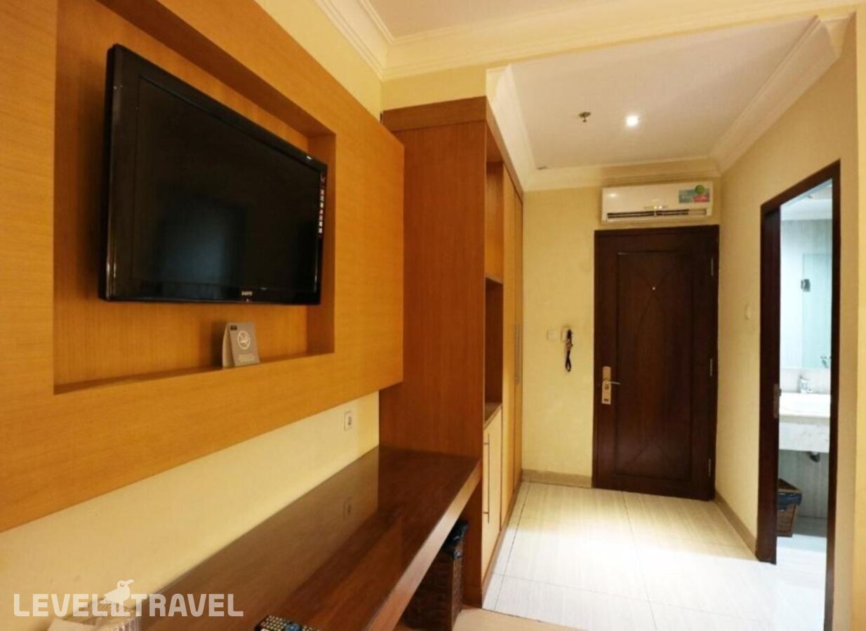 фотографии номера Семейный (две односпальные кровати) отеля Coin's Hotel Jakarta в Индонезия(Джакарта) - фото №7