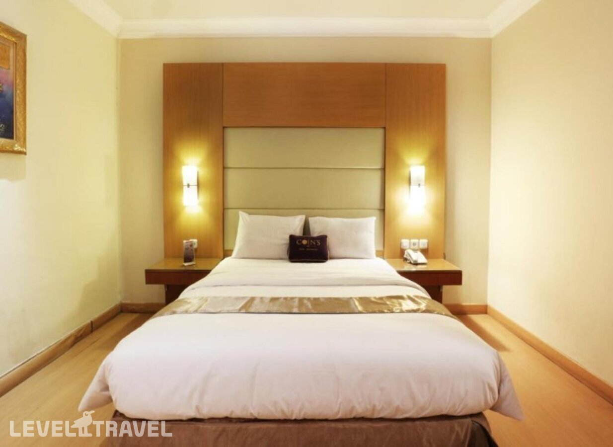 фотографии номера Семейный (две односпальные кровати) отеля Coin's Hotel Jakarta в Индонезия(Джакарта) - фото №1