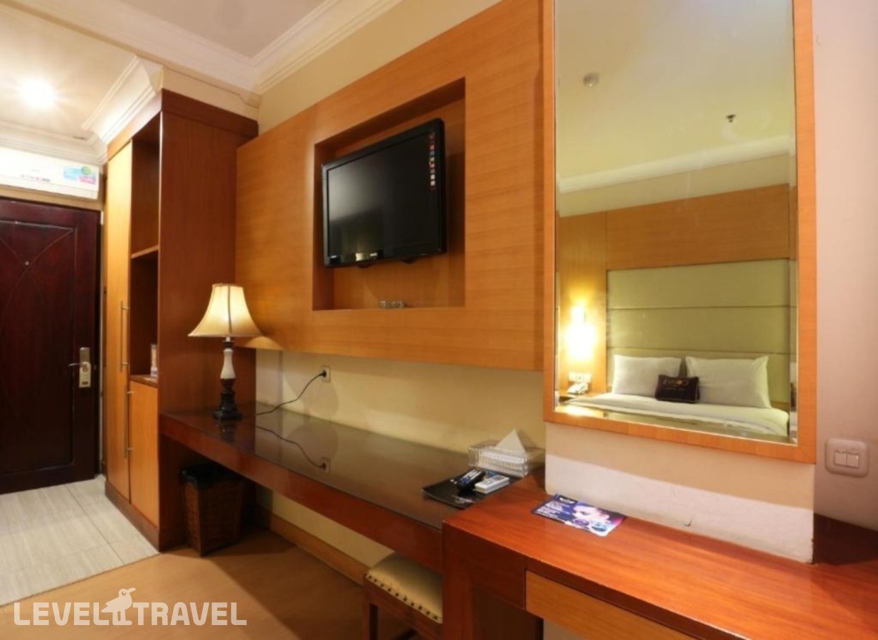 фотографии номера Делюкс отеля Coin's Hotel Jakarta в Индонезия(Джакарта) - фото №2