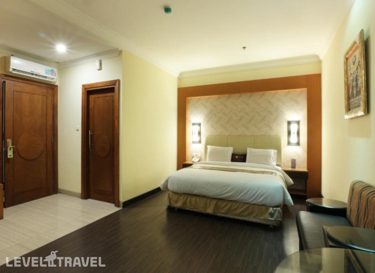 фотографии номера Номер Представительский отеля Coin's Hotel Jakarta в Индонезия(Джакарта) - фото №1