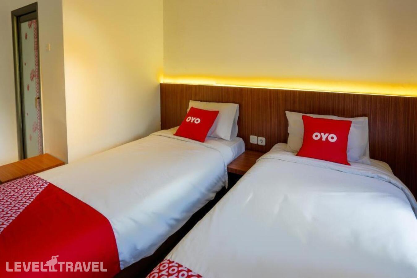 фотографии номера Стандартный (две односпальные кровати) отеля Oyo 3109 Point Inn в Индонезия(Джакарта) - фото №8