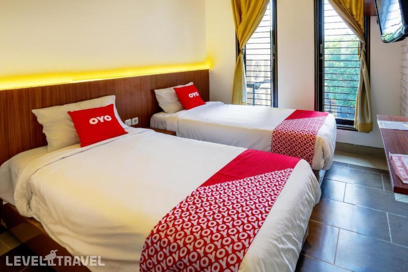 фотографии номера Стандартный (две односпальные кровати) отеля Oyo 3109 Point Inn в Индонезия(Джакарта) - фото №7