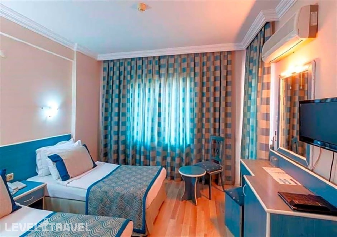 фотографии номера Стандартный с балконом с частичным видом на море отеля Galaxy Beach Hotel в Турция(Махмутлар) - фото №1