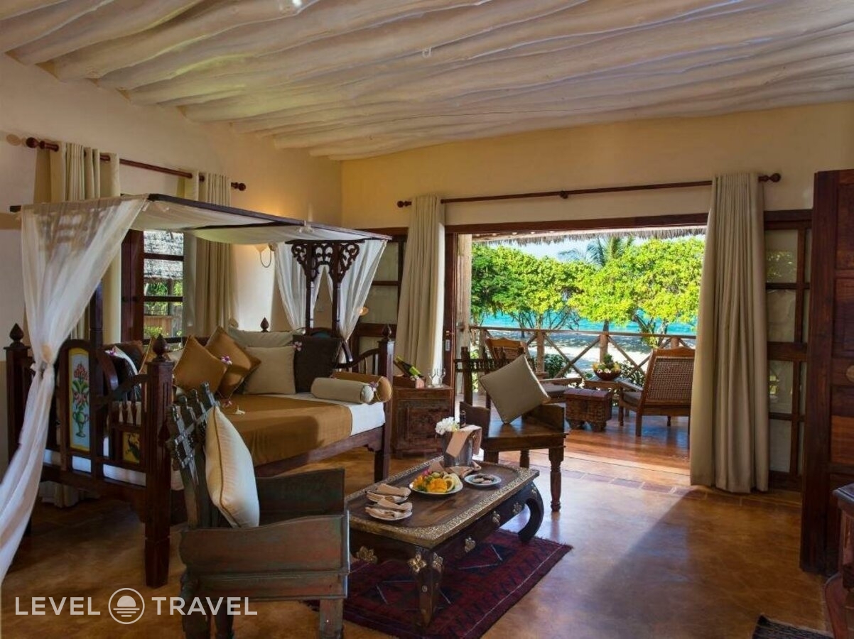 фотографии номера Люкс пляжный отеля Neptune Pwani Beach Resort & Spa в Танзания(Пвани Мчангани) - фото №2